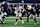 ARLINGTON, TEXAS - NOVEMBER 28: Drew Lock #2 of the New York Giants runs the ball against Micah Parsons #11 of the Dallas Cowboys during the first quarter at AT&T Stadium on November 28, 2024 in Arlington, Texas. (Photo by Ron Jenkins/Getty Images)