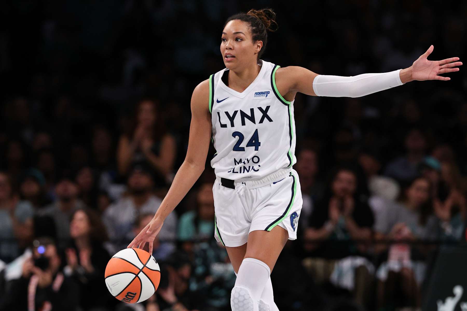NEW YORK, NEW YORK - OCTOBER 20: (EDITOR'S NOTE: This image was sent with alternate crop.) Napheesa Collier #24 of the Minnesota Lynx calls a play during the first half against the New York Liberty during Game Five of the WNBA Finals at Barclays Center on October 20, 2024 in New York City. (Photo by Elsa/Getty Images)
