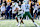 ANNAPOLIS, MD - NOVEMBER 16: Tulane Green Wave running back Makhi Hughes (21) takes the hand off from quarterback Darian Mensah (10) during the Tulane Green Wave game versus the Naval Academy Midshipmen on November 16, 2024 at Navy - Marine Corps Memorial Stadium in Annapolis, MD. (Photo by Mark Goldman/Icon Sportswire via Getty Images)