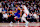 TORONTO, CANADA - DECEMBER 9: Karl-Anthony Towns #32 of the New York Knicks dribbles the ball against Scottie Barnes #4 of the Toronto Raptors during the first half of their NBA game at Scotiabank Arena on December 9, 2024 in Toronto, Canada . NOTE TO USER: User expressly acknowledges and agrees that by downloading and/or using this photograph, User is agreeing to the terms and conditions of the Getty Images License Agreement. (Photo by Cole Burston/Getty Images)