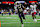 NEW ORLEANS, LOUISIANA - DECEMBER 15: Alvin Kamara #41 of the New Orleans Saints catches a pass with one hand for a touchdown during the third quarter against the Washington Commanders at Caesars Superdome on December 15, 2024 in New Orleans, Louisiana. (Photo by Jonathan Bachman/Getty Images)