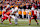 COLUMBUS, OHIO - DECEMBER 21: Nico Iamaleava #8 of the Tennessee Volunteers is tackled by Jack Sawyer #33 of the Ohio State Buckeyes during the second quarter in the Playoff First Round Game at Ohio Stadium on December 21, 2024 in Columbus, Ohio.  (Photo by Jason Mowry/Getty Images)