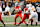 Ohio State Buckeyes quarterback Will Howard throws a touchdown pass during CFP first round against Tennessee Volunteers on December 21, 2024.