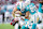 MIAMI GARDENS, FLORIDA - DECEMBER 22: Zach Sieler #92 of the Miami Dolphins tackles Patrick Taylor Jr. #32 of the San Francisco 49ers during the second quarter at Hard Rock Stadium on December 22, 2024 in Miami Gardens, Florida. (Photo by Carmen Mandato/Getty Images)
