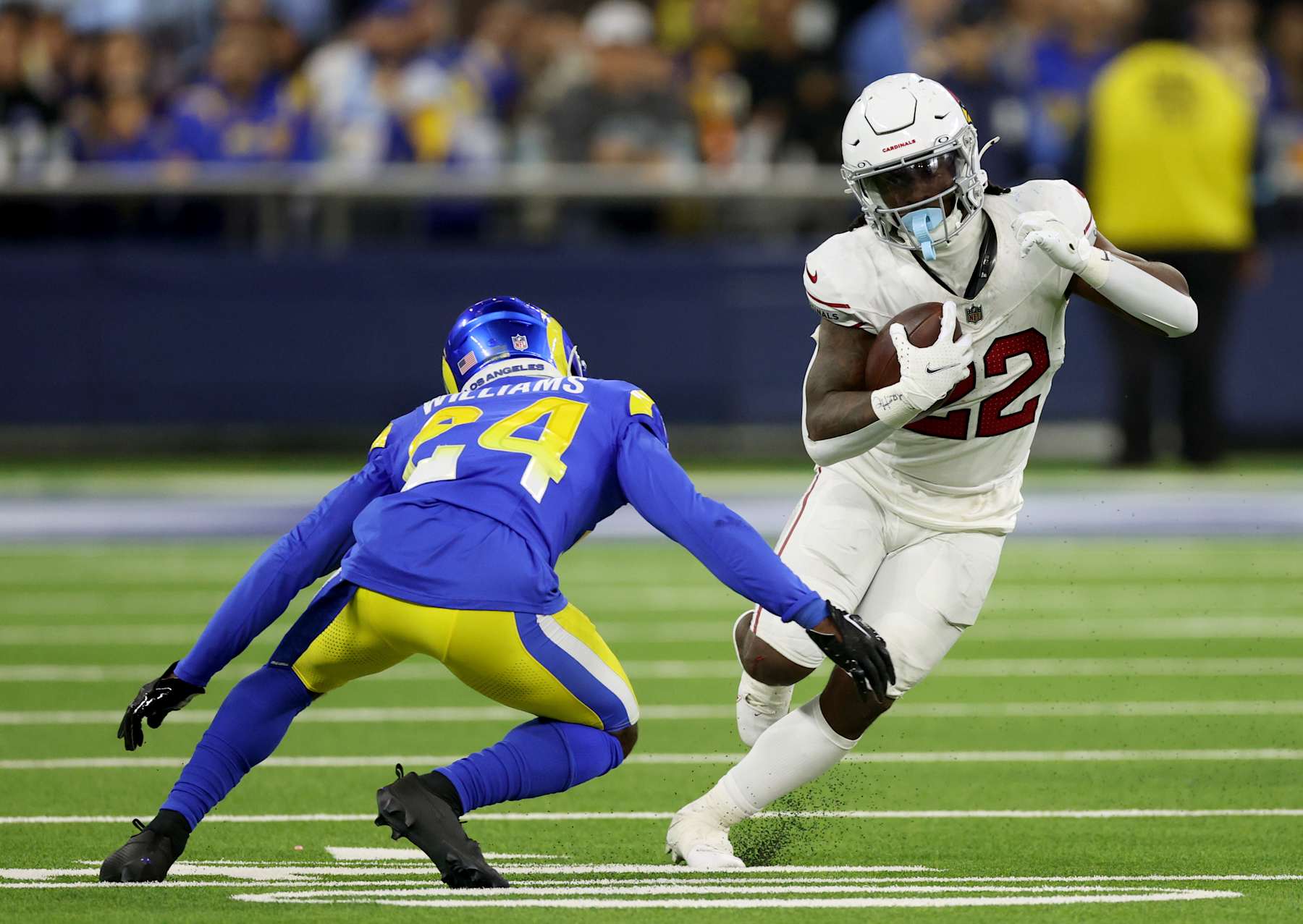 Football Football INGLEWOOD, CALIFORNIA - DECEMBER 28: Michael Carter #22 of the Arizona Cardinals cuts back on his run in front of Darious Williams #24 of the Los Angeles Rams during a 13-9 loss to the Los Angeles Rams at SoFi Stadium on December 28, 2024 in Inglewood, California. (Photo by Harry How/Getty Images)