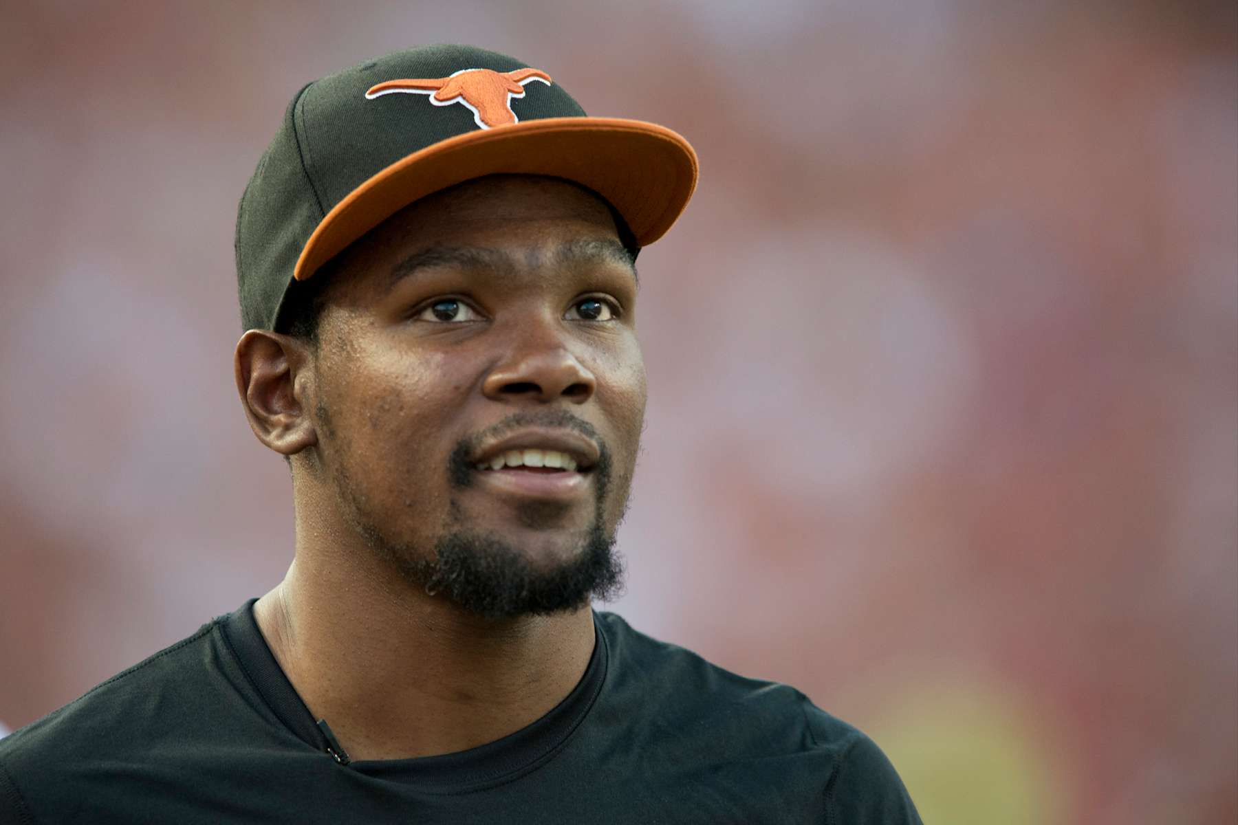 Football Football AUSTIN, TX - SEPTEMBER 14: Kevin Durant of the Oklahoma City Thunder enjoys the game from the sidelines as the Texas Longhorns host the Mississippi Rebels on September 14, 2013 at Darrell K Royal-Texas Memorial Stadium in Austin, Texas. (Photo by Cooper Neill/Getty Images)