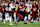 LANDOVER, MD - DECEMBER 29: Washington Commanders wide receiver Olamide Zaccheaus (14) hauls in a pass then runs upfield, maneuvering to evade Atlanta Falcons linebacker Kaden Elliss (55) during the Atlanta Falcons game versus the Washington Commanders at Northwest Stadium on December 29, 2024, in Landover, MD. (Photo by Lee Coleman/Icon Sportswire via Getty Images)