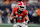 ATLANTA, GA - DECEMBER 07: Georgia Bulldogs quarterback Gunner Stockton (14) rushes the ball during the SEC Championship game between the Georgia Bulldogs and the Texas Longhorns on December 07, 2024, at Mercedes-Benz Stadium in Atlanta, GA. (Photo by Jeffrey Vest/Icon Sportswire via Getty Images)