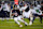 CHICAGO, ILLINOIS - DECEMBER 26: Quarterback Caleb Williams #18 of the Chicago Bears scrambles out of the pocket during the third quarter of an NFL football game against the Seattle Seahawks, at Soldier Field on December 26, 2024 in Chicago, Illinois. (Photo by Todd Rosenberg/Getty Images)
