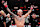 Charles Oliveira reacts after his unanimous decision victory against Michael Chandler 