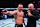 Michael Chandler talks to Joe Rogan after his loss to Charles Oliveira