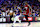 PHILADELPHIA, PENNSYLVANIA – APRIL 17: Joel Embiid #21 of the Philadelphia 76ers dribbles past Jimmy Butler #22 of the Miami Heat during the first quarter of the Eastern Conference Play-In Tournament at the Wells Fargo Center on April 17, 2024 in Philadelphia. Pennsylvania. NOTE TO USER: The user expressly acknowledges and agrees that by downloading or using this photograph, the user agrees to the terms and conditions of the Getty Images License Agreement. (Photo by Tim Nwachukwu/Getty Images)