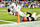 CLEVELAND, OHIO - DECEMBER 29: Jonnu Smith #9 of the Miami Dolphins scores a touchdown against Grant Delpit #9 of the Cleveland Browns during the fourth quarter at Huntington Bank Field on December 29, 2024 in Cleveland, Ohio. (Photo by Jason Miller/Getty Images)
