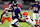 BALTIMORE, MARYLAND - JANUARY 04: Lamar Jackson #8 of the Baltimore Ravens runs with the ball while defended by Winston Reid #59 of the Cleveland Browns during the first quarter at M&T Bank Stadium on January 04, 2025 in Baltimore, Maryland. (Photo by Greg Fiume/Getty Images)