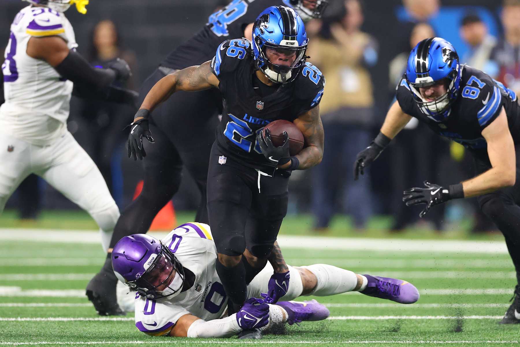 Football DETROIT, MICHIGAN - JANUARY 05: Jahmyr Gibbs #26 of the Detroit Lions is tackled by Ivan Pace Jr. #0 of the Minnesota Vikings during the second quarter at Ford Field on January 05, 2025 in Detroit, Michigan. (Photo by Gregory Shamus/Getty Images)