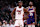 PHOENIX, ARIZONA - NOVEMBER 06: Jimmy Butler #22 of the Miami Heat and Kevin Durant #35 of the Phoenix Suns looks on during the game at Footprint Center on November 06, 2024 in Phoenix, Arizona. The Suns defeated the Heat 115-112. NOTE TO USER: User expressly acknowledges and agrees that, by downloading and or using this photograph, User is consenting to the terms and conditions of the Getty Images License Agreement. (Photo by Chris Coduto/Getty Images)
