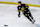 BRANDON, CANADA - APRIL 03: Roger McQueen #13 of the Brandon Wheat Kings plays the puck during first period action against the Moose Jaw Warriors in Game Three of the First Round of the 2024 WHL Playoffs at Westoba Place on April 03, 2024 in Brandon, Manitoba, Canada. (Photo by Jonathan Kozub/Getty Images)