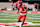 TUCSON, ARIZONA - NOVEMBER 30: Wide receiver Tetairoa McMillan #4 of the University of Arizona Wildcats runs some pregame drills before the University of Arizona Wildcats versus the Arizona State Sun Devils football game at Arizona Stadium on November 30, 2024 in Tucson, Arizona. (Photo by Bruce Yeung/Getty Images)