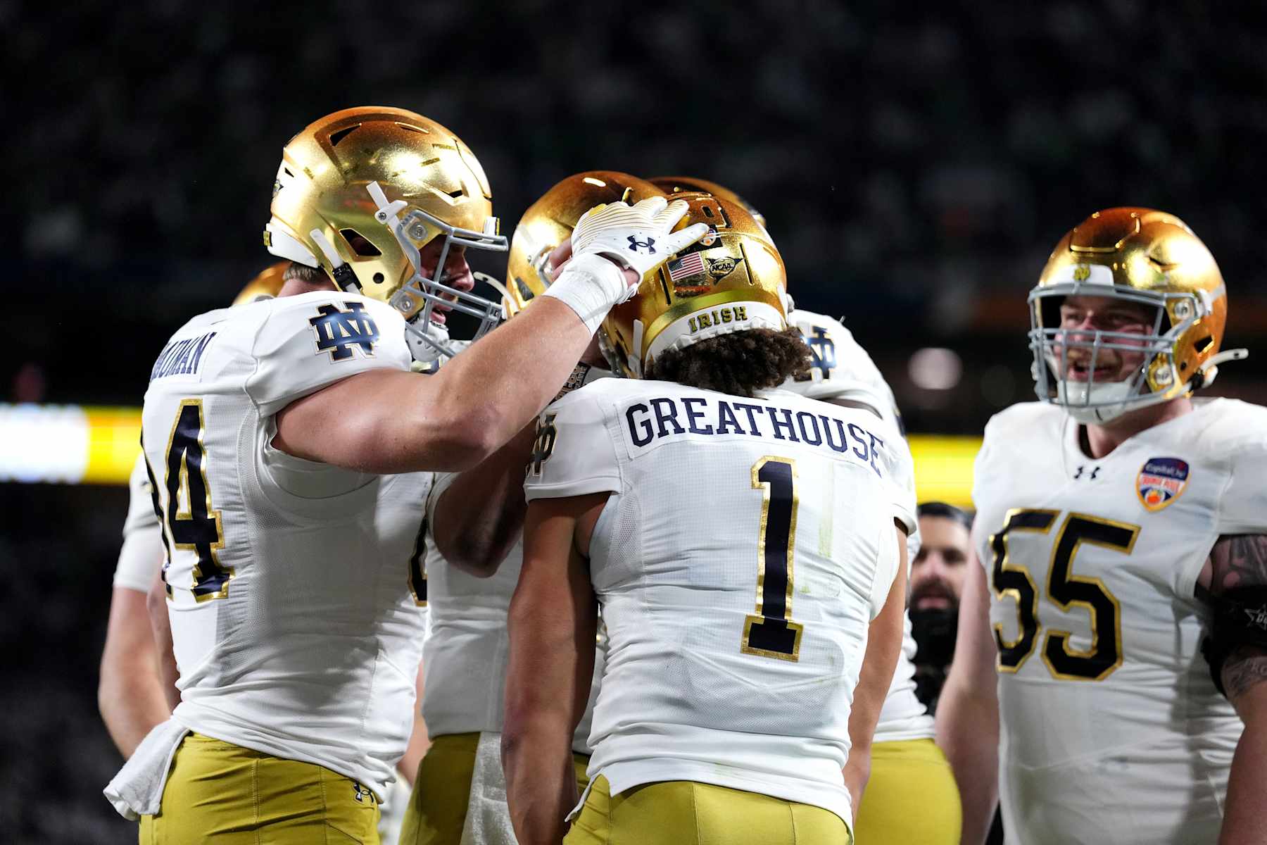 Football MIAMI GARDENS, FLORIDA - JANUARY 09: Jaden Greathouse #1 of the Notre Dame Fighting Irish celebrates with teammates after catching a pass for a touchdown during the fourth quarter against the Penn State Nittany Lions in the Capital One Orange Bowl at Hard Rock Stadium on January 09, 2025 in Miami Gardens, Florida. (Photo by Rich Storry/Getty Images)