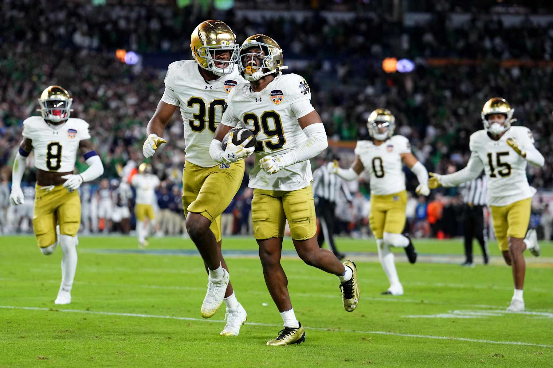 Football MIAMI GARDENS, FLORIDA - JANUARY 09: Christian Gray #29 of the Notre Dame Fighting Irish celebrates with teammates after making an interception during the fourth quarter against the Penn State Nittany Lions in the Capital One Orange Bowl at Hard Rock Stadium on January 09, 2025 in Miami Gardens, Florida. (Photo by Rich Storry/Getty Images)