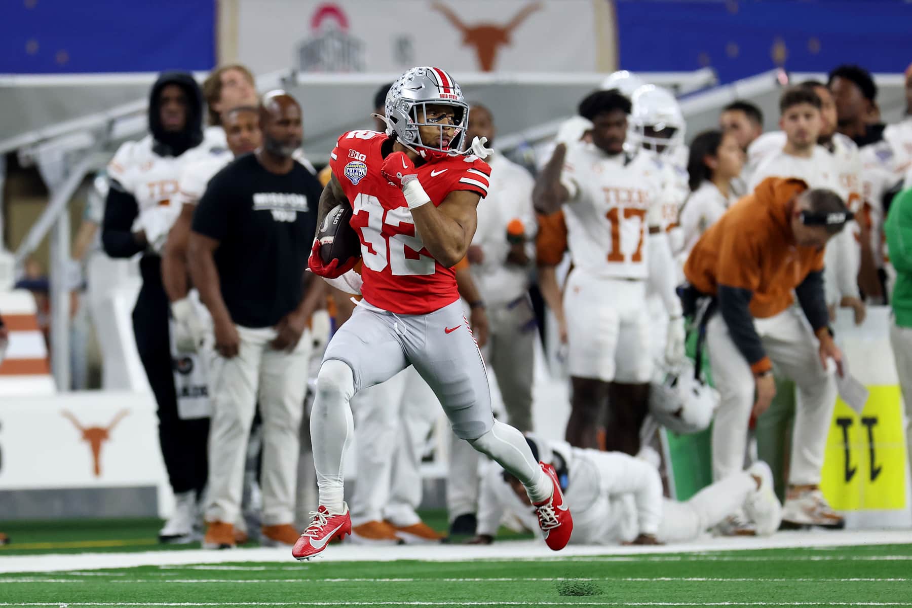 Football ARLINGTON, TEXAS - JANUARY 10: TreVeyon Henderson #32 of the Ohio State Buckeyes runs with the ball in the second quarter against the Texas Longhorns during the Goodyear Cotton Bowl at AT&T Stadium on January 10, 2025 in Arlington, Texas. (Photo by Jamie Squire/Getty Images)