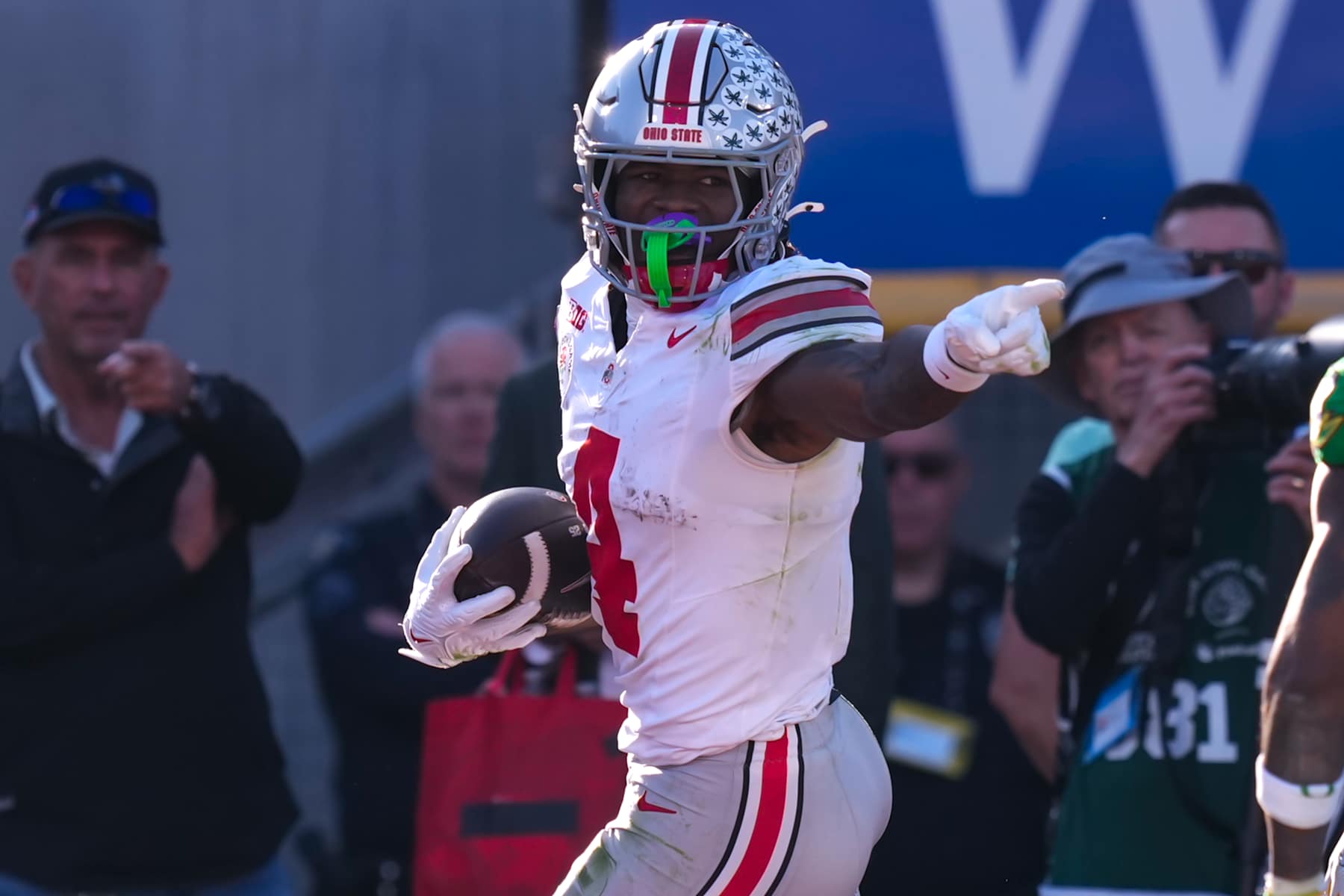Football LOS ANGELES, CA - JANUARY 1: Jeremiah Smith #4 of the Ohio State Buckeyes touchdown celebration during a game between Ohio State Buckeyes and Oregon Ducks at Rose Bowl Stadium on January 1, 2025 in Los Angeles, California. (Photo by Melinda Meijer/ISI Photos/Getty Images)