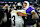 BALTIMORE, MD - JANUARY 11: Lamar Jackson #8 of the Baltimore Ravens talks with Pittsburgh Steelers quarterback Russell Wilson (3) after an NFL football wild card playoff game at M&T Bank Stadium on January 11, 2025 in Baltimore, Maryland. (Photo by Cooper Neill/Getty Images)