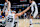 SAN ANTONIO, TX - OCTOBER 25: Zach Collins #23 is helped up by Cedi Osman #16 and Tre Jones #33 of the San Antonio Spurs during the game against the Dallas Mavericks on October 25, 2023 at the Frost Bank Center in San Antonio, Texas. NOTE TO USER: User expressly acknowledges and agrees that, by downloading and or using this photograph, user is consenting to the terms and conditions of the Getty Images License Agreement. Mandatory Copyright Notice: Copyright 2023 NBAE (Photos by Michael Gonzales/NBAE via Getty Images)