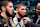 Khabib Nurmagomedov, center, speaks to Daniel Cormier after his teammate Islam Makhachev, left, won the UFC lightweight title.