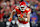 KANSAS CITY, MISSOURI - JANUARY 18: Travis Kelce #87 of the Kansas City Chiefs carries the ball against the Houston Texans during the fourth quarter in the AFC Divisional Playoff at GEHA Field at Arrowhead Stadium on January 18, 2025 in Kansas City, Missouri. (Photo by David Eulitt/Getty Images)