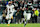 PHILADELPHIA, PENNSYLVANIA - NOVEMBER 14: Saquon Barkley #26 of the Philadelphia Eagles runs the ball against Frankie Luvu #4 of the Washington Commanders at Lincoln Financial Field on November 14, 2024 in Philadelphia, Pennsylvania. (Photo by Mitchell Leff/Getty Images)
