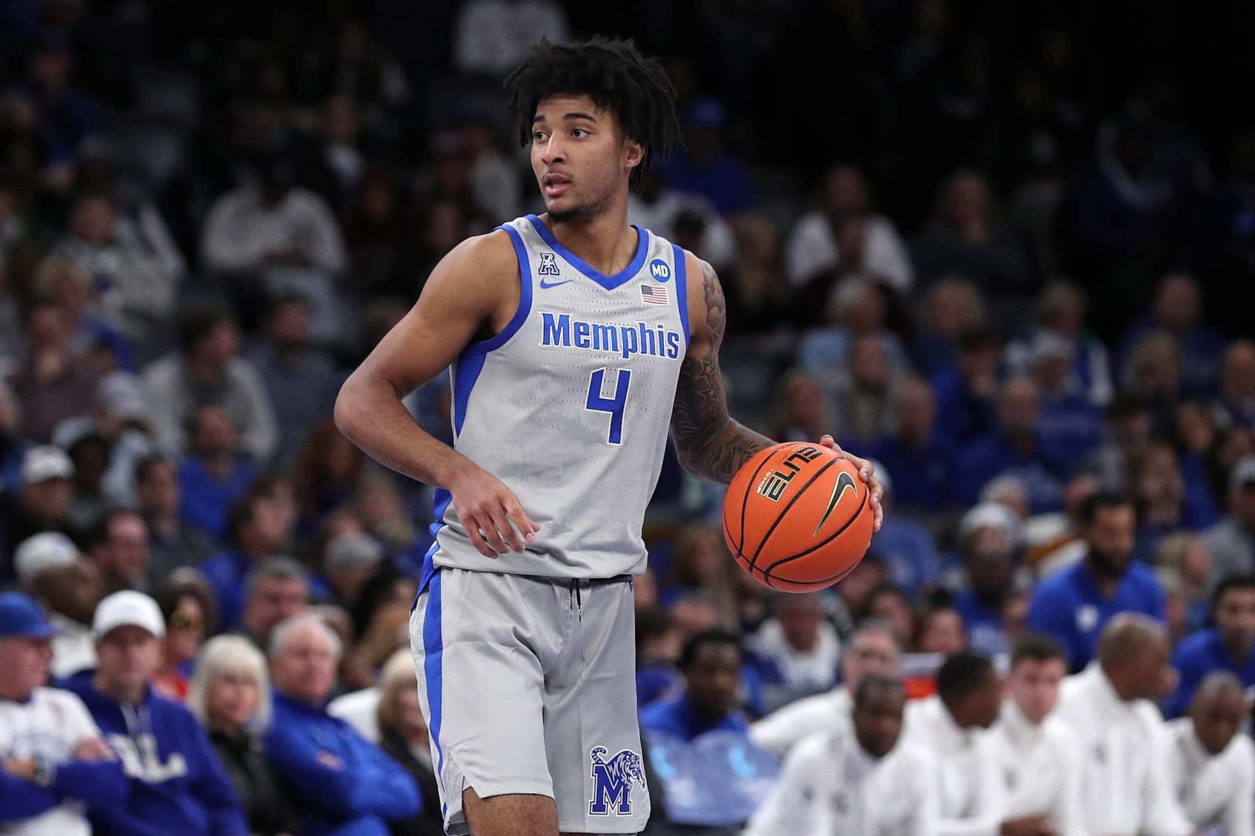 basketball basketball MEMPHIS, TENNESSEE - DECEMBER 21: PJ Haggerty #4 of the Memphis Tigers handles the ball during the game against the Mississippi State Bulldogs at FedExForum on December 21, 2024 in Memphis, Tennessee. (Photo by Justin Ford/Getty Images)