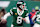 EAST RUTHERFORD, NEW JERSEY - JANUARY 5: Quarterback Aaron Rodgers #8 of the New York Jets rolls out to pass the ball in the game between the Miami Dolphins against the New York Jets at MetLife Stadium on January 5, 2025 in East Rutherford, New Jersey. (Photo by Al Pereira/Getty Images)