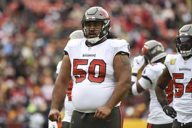 Vita Vea has a hard time swapping jerseys