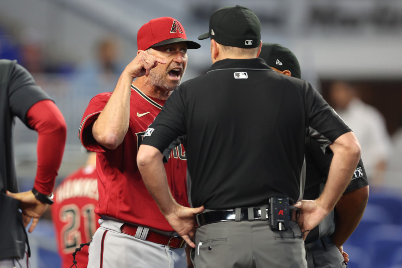 Arizona's Madison Bumgarner held back by teammates after first