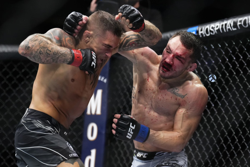 NEW YORK, NEW YORK - NOVEMBER 12: (R-L) Michael Chandler punches Dustin Poirier in a lightweight bout during the UFC 281 event at Madison Square Garden on November 12, 2022 in New York City. (Photo by Chris Unger/Zuffa LLC)