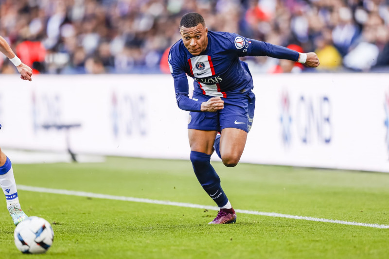 PARIS, FRANCE - NOVEMBER 13: Kylian Mbappe of Paris Saint Germain chases the ball during the Ligue 1 match between Paris Saint-Germain and AJ Auxerre at Parc des Princes on November 13, 2022 in Paris, France. (Photo by Antonio Borga/Eurasia Sport Images/Getty Images)