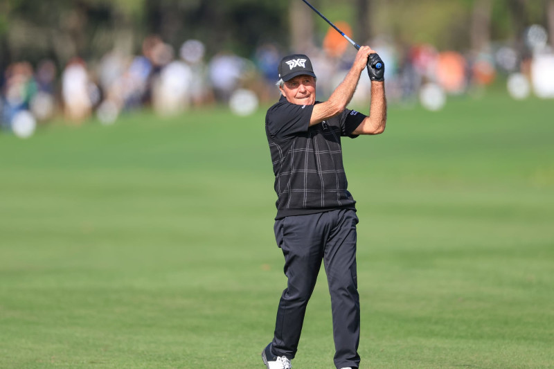 ORLANDO, FLORIDA - DECEMBER 16: Gary Player of South Africa  plays his second shot on the 18th hole during the Friday pro-am as a preview for the 2022 PNC Championship at The Ritz-Carlton Golf Club on December 16, 2022 in Orlando, Florida. (Photo by David Cannon/Getty Images)