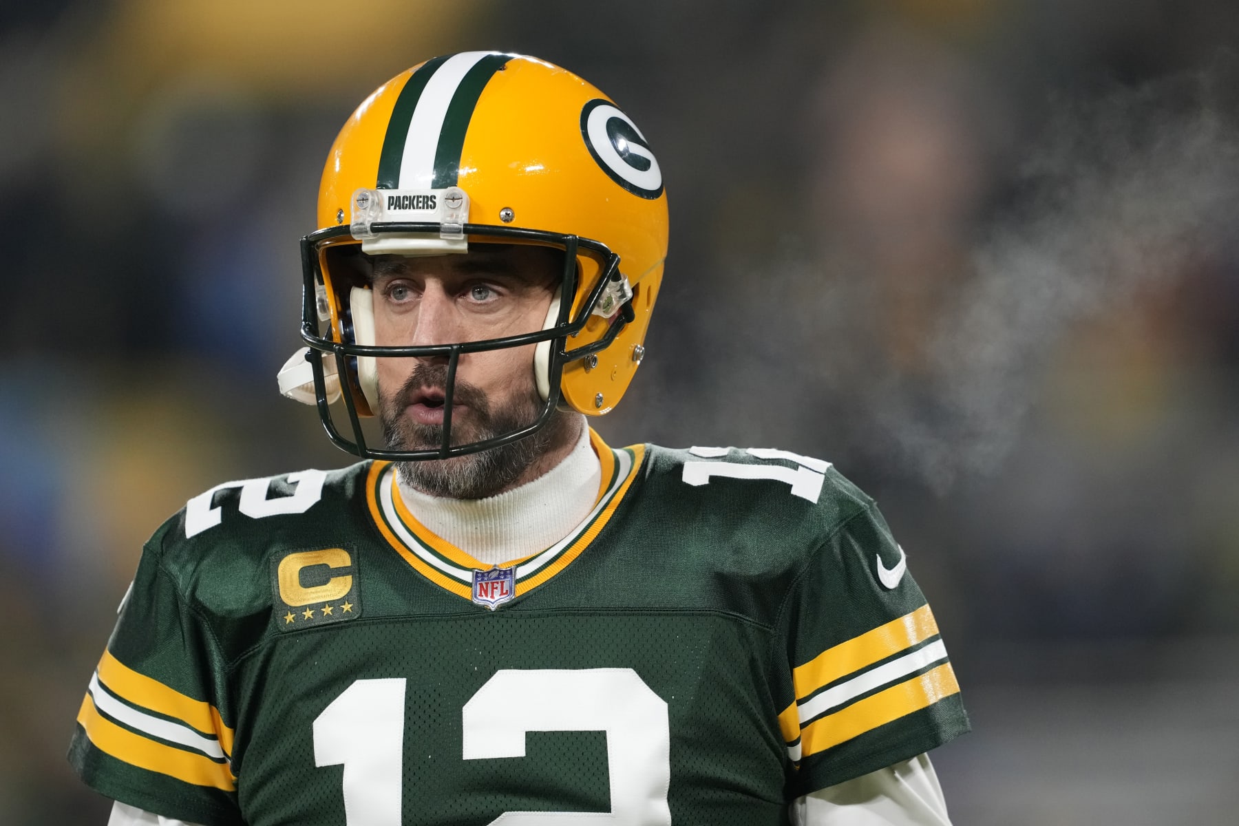 GREEN BAY, WISCONSIN - JANUARY 08: Aaron Rodgers #12 of the Green Bay Packers warms up prior to the game against the Detroit Lions at Lambeau Field on January 08, 2023 in Green Bay, Wisconsin. (Photo by Patrick McDermott/Getty Images)