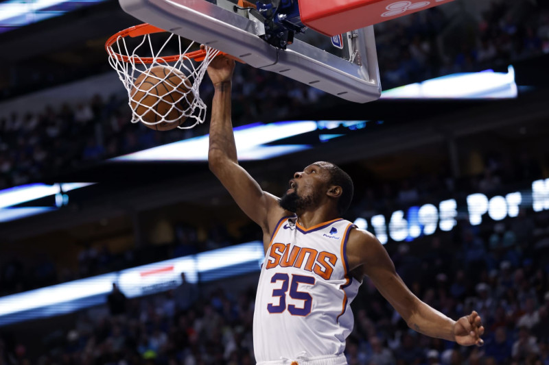 DALLAS, TX - MARCH 5: Kevin Durant #35 of the Phoenix Suns slam dunks against the Dallas Mavericks in the second half at American Airlines Center on March 5, 2023 in Dallas, Texas. The Suns won 130-126. NOTE TO USER: User expressly acknowledges and agrees that, by downloading and or using this photograph, User is consenting to the terms and conditions of the Getty Images License Agreement. (Photo by Ron Jenkins/Getty Images)