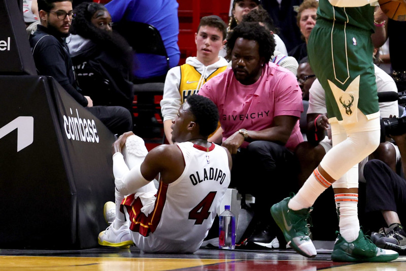 MIAMI, FLORIDA - APRIL 22: Victor Oladipo #4 of the Miami Heat reacts after suffering an injury during the fourth quarter against the Milwaukee Bucks during Game Three of the Eastern Conference First Round Playoffs at Kaseya Center on April 22, 2023 in Miami, Florida. NOTE TO USER: User expressly acknowledges and agrees that, by downloading and or using this photograph, User is consenting to the terms and conditions of the Getty Images License Agreement. (Photo by Megan Briggs/Getty Images)