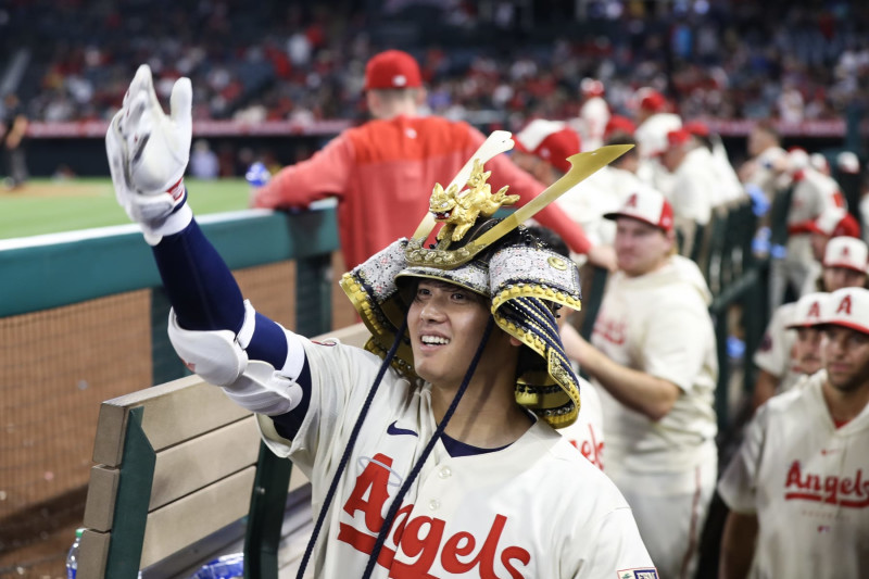 Shohei Ohtani of the Los Angeles Angels grabs his right forearm as