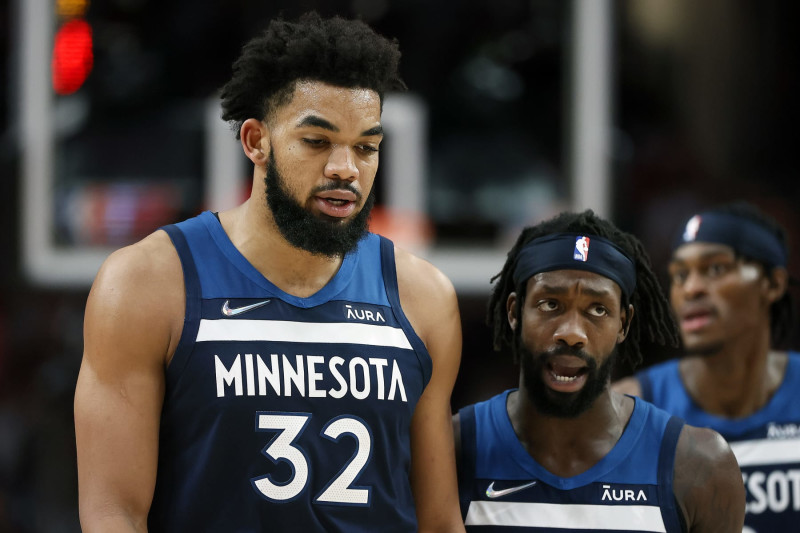 PORTLAND, OREGON - DECEMBER 12: Patrick Beverley (R) talks with Karl-Anthony Towns # 32 of the Minnesota Timberwolves during the first half against the Portland Trail Blazers at Moda Center on December 12, 2021 in Portland, Oregon. NOTE TO USER: User expressly acknowledges and agrees that, by downloading and or using this photograph, User is consenting to the terms and conditions of the Getty Images License Agreement. (Photo by Soobum Im/Getty Images)