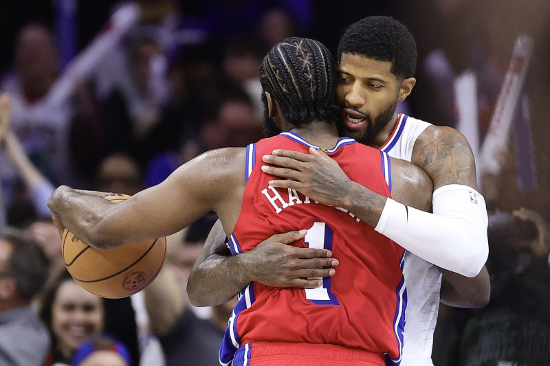 PHILADELPHIA, PENNSYLVANIA - DECEMBER 23: James Harden #1 of the Philadelphia 76ers and Paul George #13 of the LA Clippers embrace following a game at Wells Fargo Center on December 23, 2022 in Philadelphia, Pennsylvania. NOTE TO USER: User expressly acknowledges and agrees that, by downloading and or using this photograph, User is consenting to the terms and conditions of the Getty Images License Agreement. (Photo by Tim Nwachukwu/Getty Images)