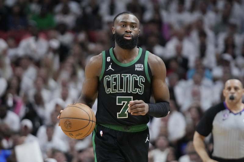 Boston Celtics guard Jaylen Brown (7) dribbles the ball during Game 3 of the NBA basketball playoffs Eastern Conference finals against the Miami Heat, Sunday, May 21, 2023, in Miami. (AP Photo/Wilfredo Lee)