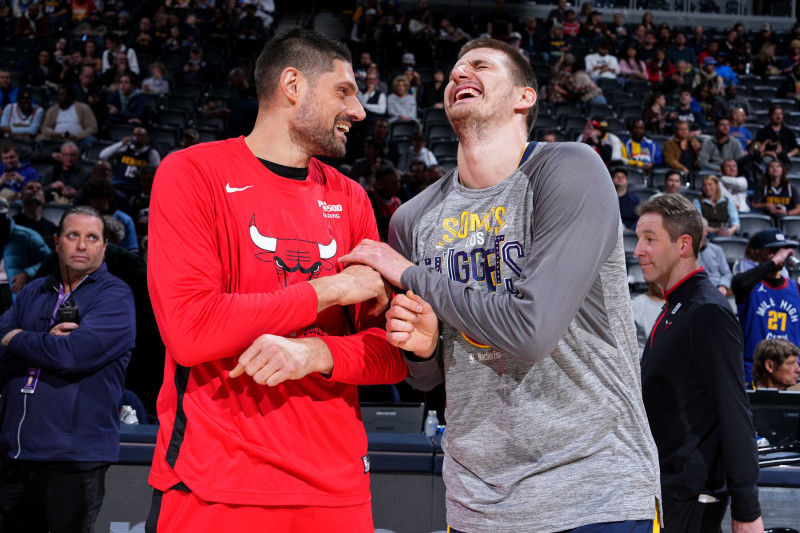 DENVER, CO - JANUARY 1: Nikola Vucevic #9 of the Chicago Bulls talks with Nikola Jokic #15 of the Denver Nuggets before the game on January 1, 2023 at the Ball Arena in Denver, Colorado. NOTE TO USER: User expressly acknowledges and agrees that, by downloading and/or using this Photograph, user is consenting to the terms and conditions of the Getty Images License Agreement. Mandatory Copyright Notice: Copyright 2023 NBAE (Photo by Garrett Ellwood/NBAE via Getty Images)