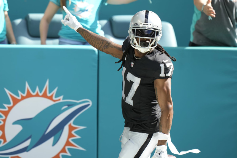 Las Vegas Raiders wide receiver Davante Adams (17) gestures after scoring a touchdown during the first half of an NFL football game against the Miami Dolphins, Sunday, Nov. 19, 2023, in Miami Gardens, Fla. (AP Photo/Wilfredo Lee)