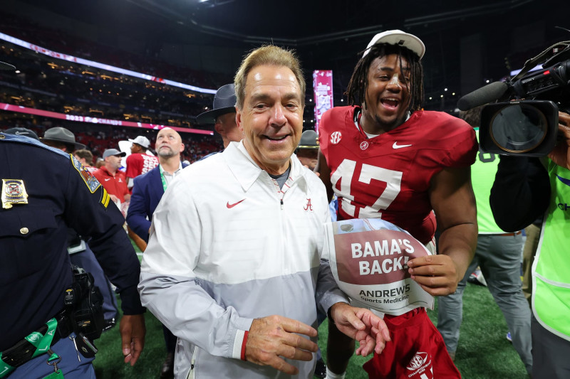 ATLANTA, GEORGIA - DECEMBER 02: Head coach Nick Saban and James Smith #47 of the Alabama Crimson Tide celebrate after defeating the Georgia Bulldogs 27-24 in the SEC Championship at Mercedes-Benz Stadium on December 02, 2023 in Atlanta, Georgia. (Photo by Kevin C. Cox/Getty Images)