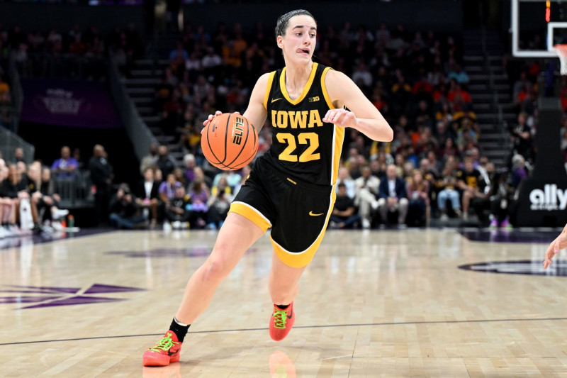 CHARLOTTE, NORTH CAROLINA - NOVEMBER 09: Caitlin Clark #22 of the Iowa Hawkeyes handles the ball against the Virginia Tech Hokies at Spectrum Center on November 09, 2023 in Charlotte, North Carolina. (Photo by G Fiume/Getty Images)