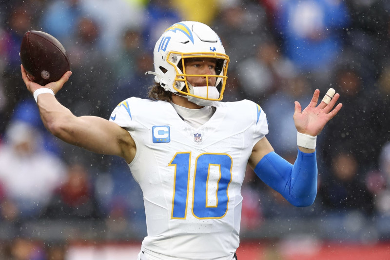 FOXBOROUGH, MASSACHUSETTS - DECEMBER 03: Justin Herbert #10 of the Los Angeles Chargers throws a pass in the first quarter against the New England Patriots at Gillette Stadium on December 03, 2023 in Foxborough, Massachusetts. (Photo by Maddie Meyer/Getty Images)